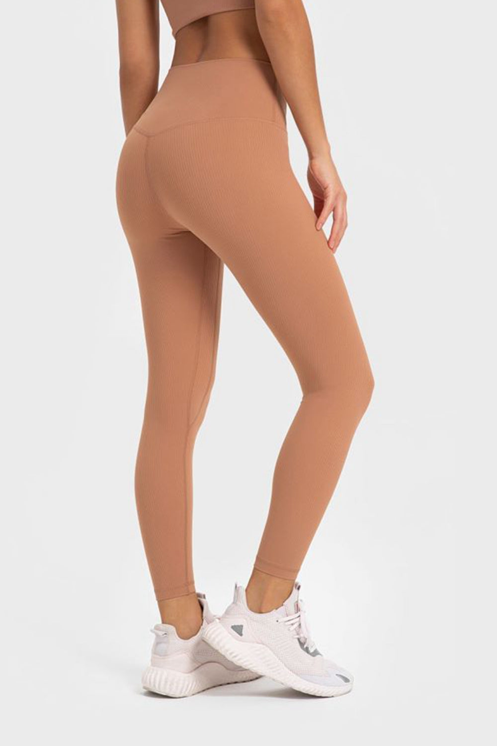 Women’s high-waisted, wide waistband leggings for yoga.