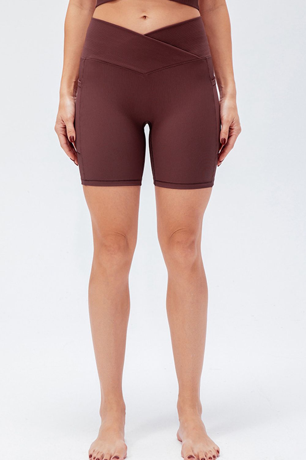 Front view of women’s high-waisted activewear shorts – breathable and stretch-fit design.