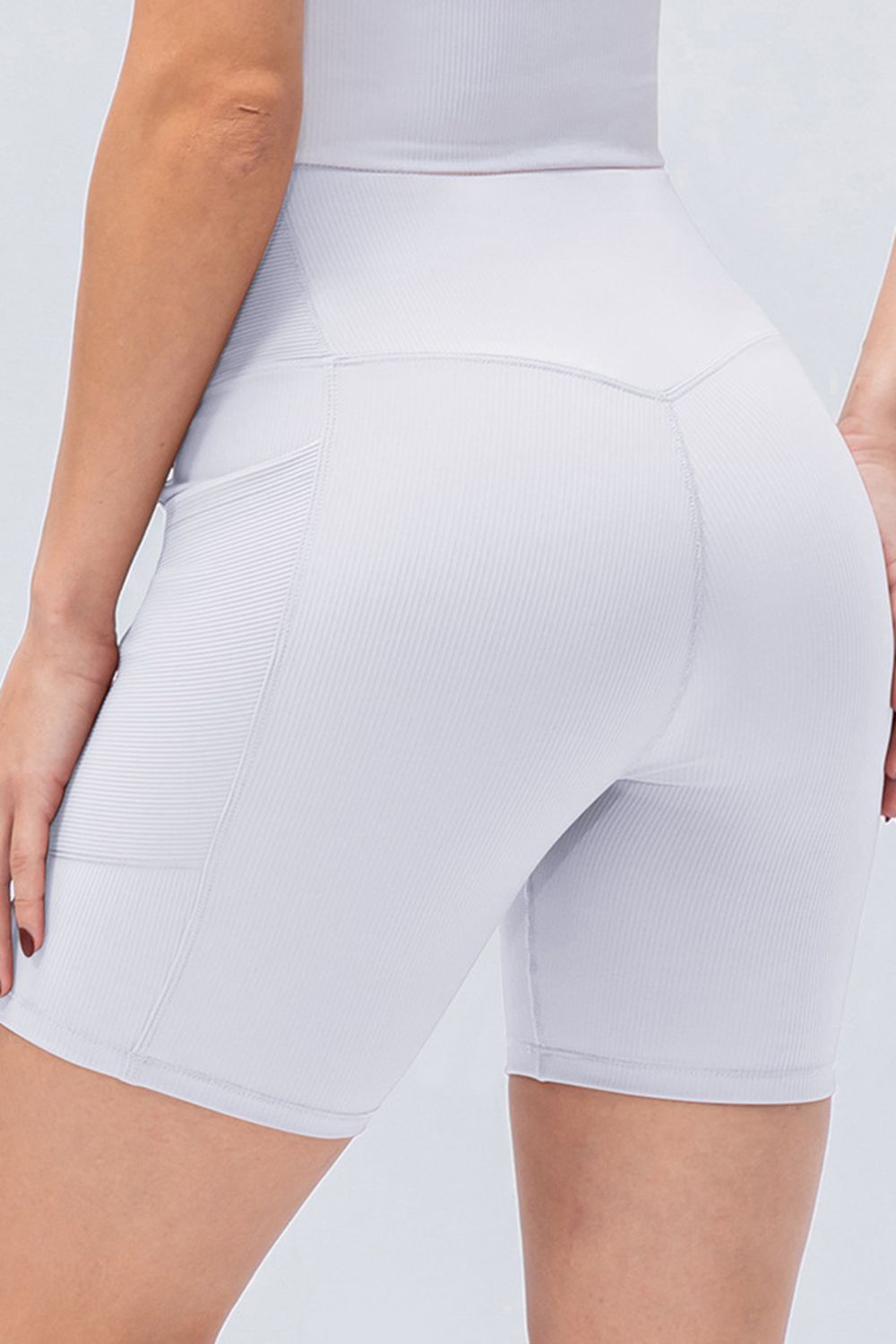 Front view of women’s high-waisted activewear shorts – breathable and stretch-fit design.