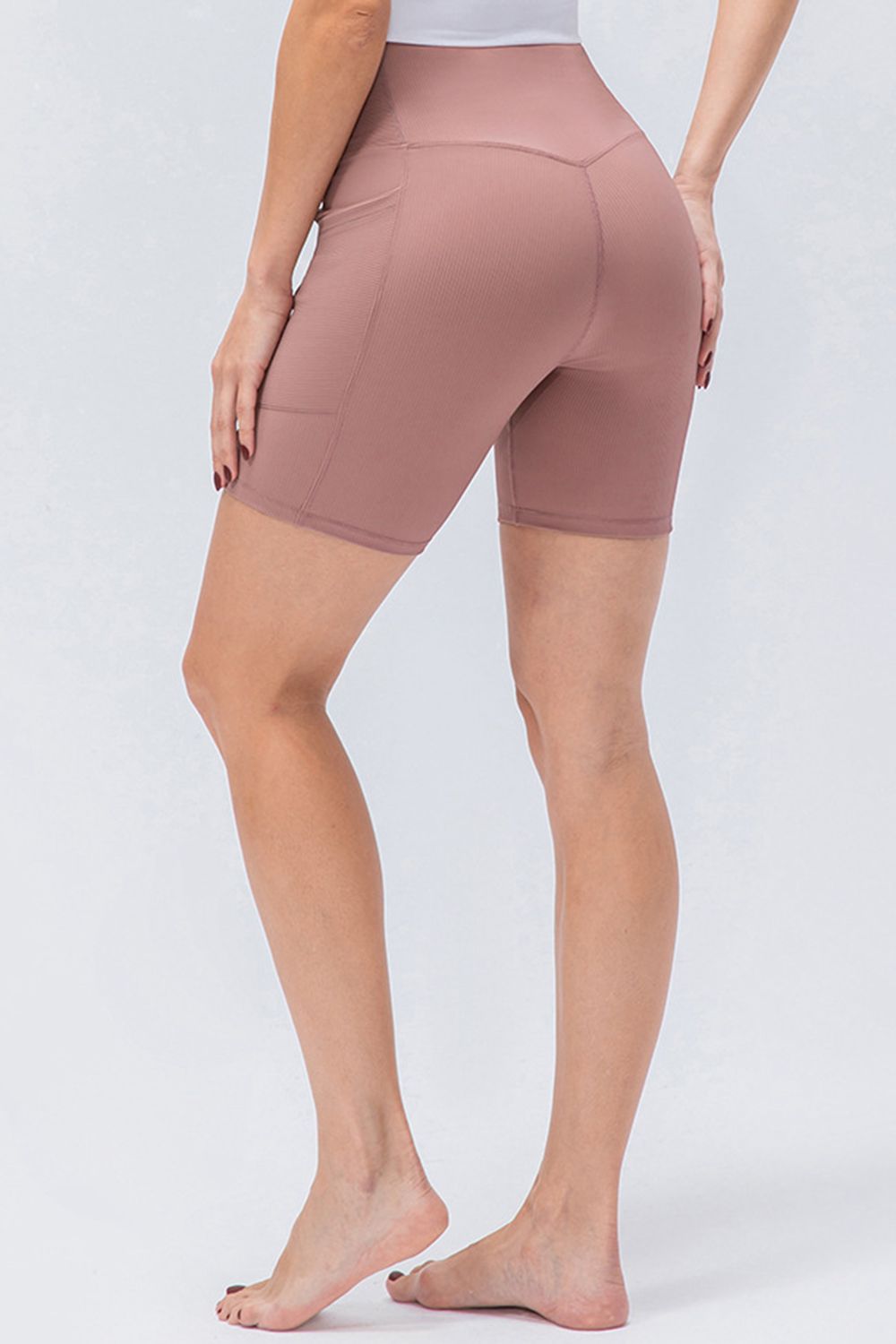 Front view of women’s high-waisted activewear shorts – breathable and stretch-fit design.