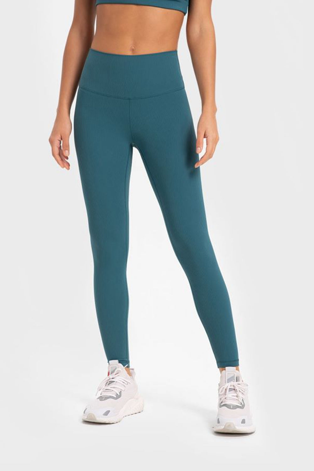 Women’s high-waisted, wide waistband leggings for yoga.