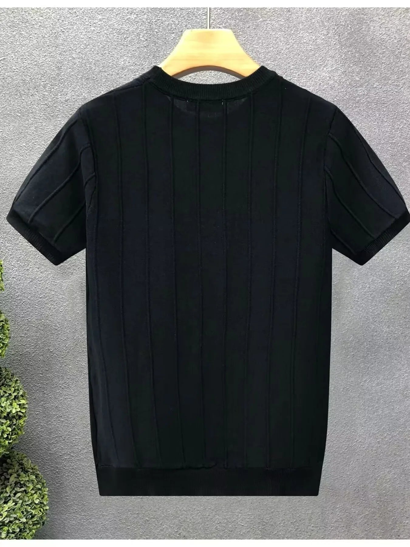 Close-up of ribbed crewneck designer t-shirt for men  premium stretch fabric.
